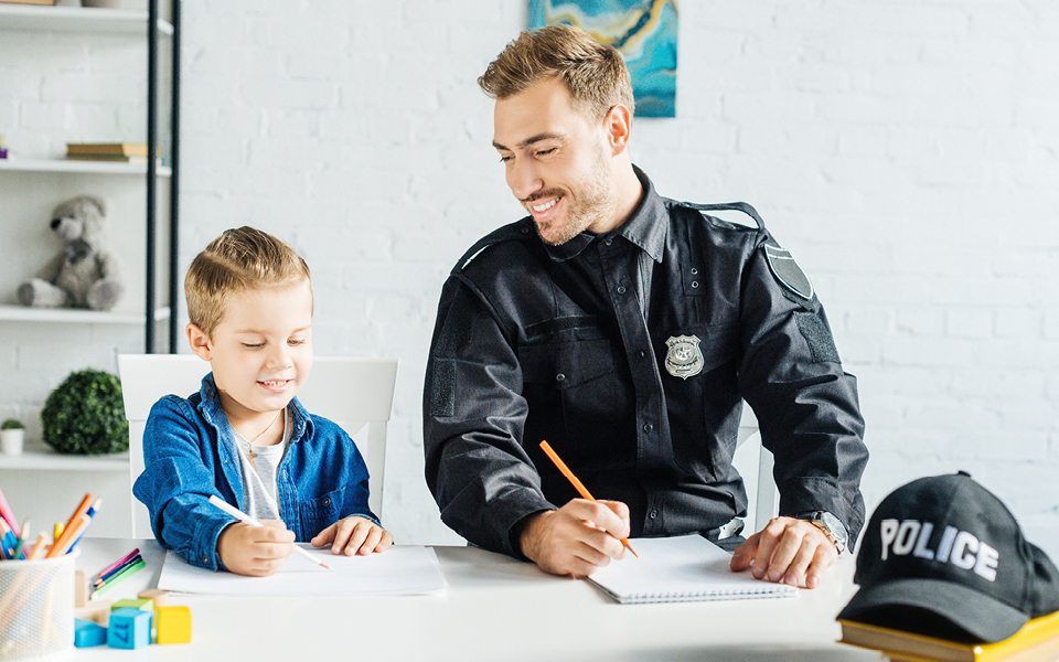 Police officer helping child