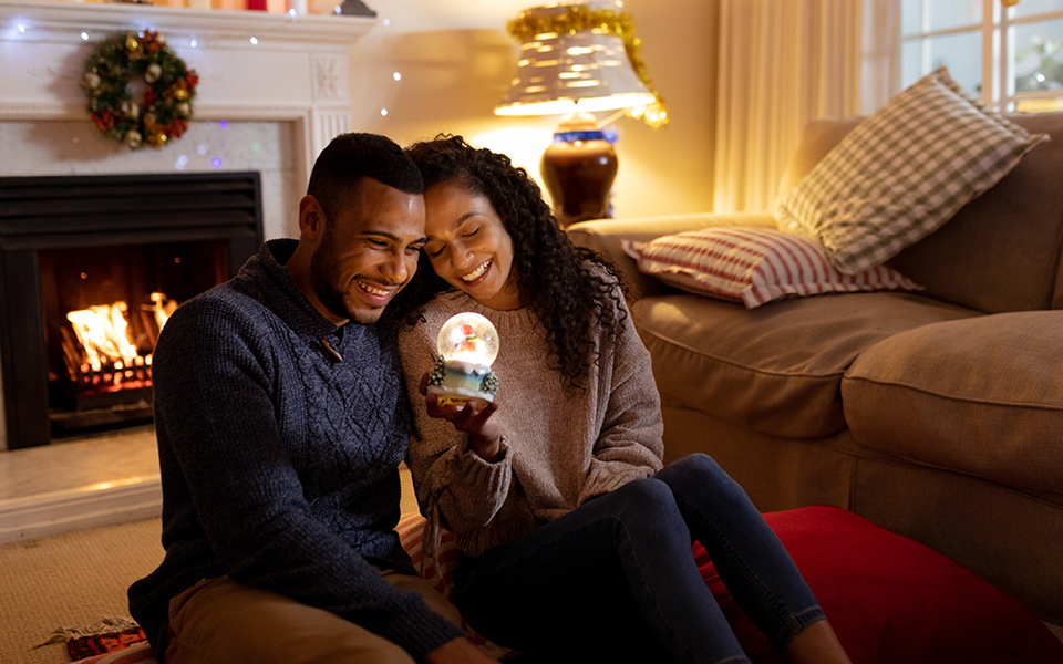 Couple with a snow globe