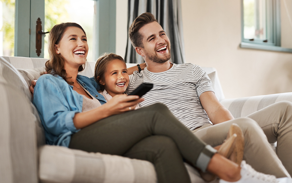 Family watching TV.