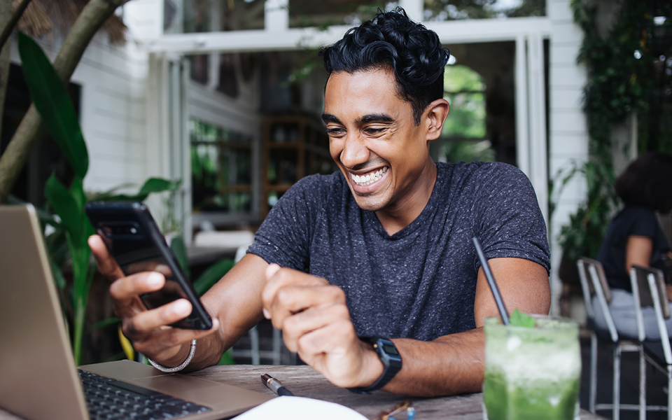 Man with a computer and phone
