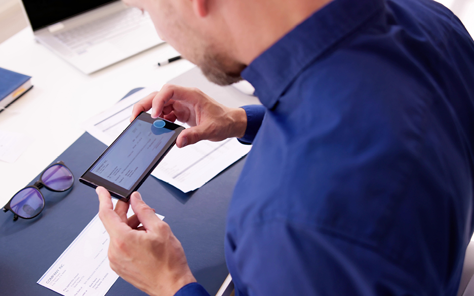 Man depositing a check with phone